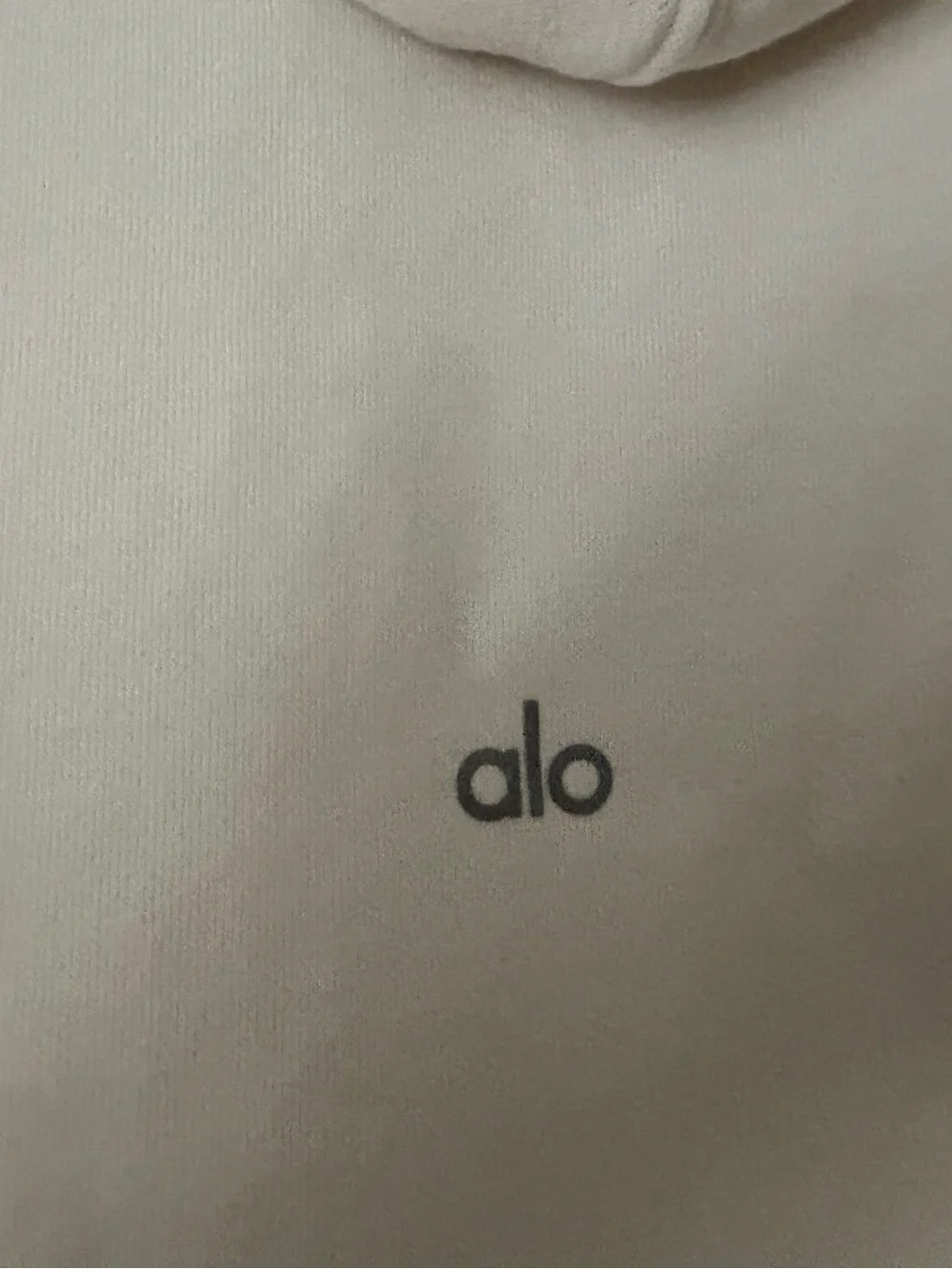 ALO Yoga Sleeveless Hooded Pullover in Light Cream